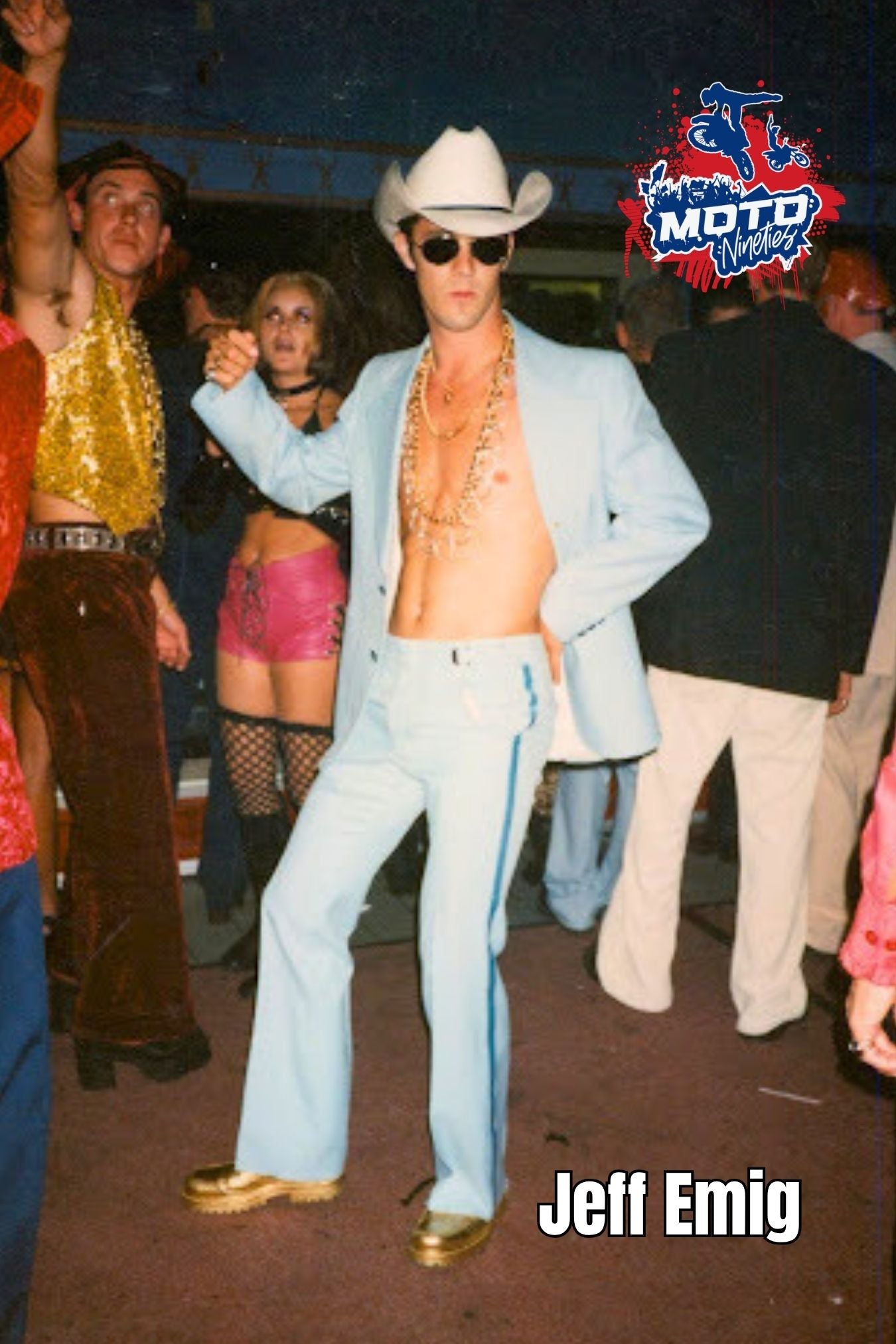 Jeff Emig wearing a cowboy hat and retro suit at a motocross-era party event. Moto Nineties 2x3 collectible magnet.