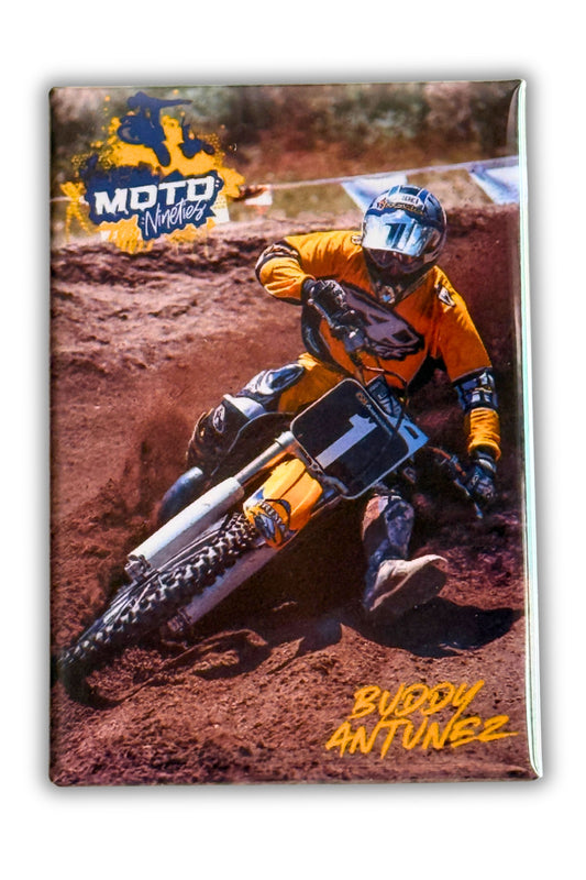 Buddy Antunez leaning hard through a dirt corner on a motocross track.