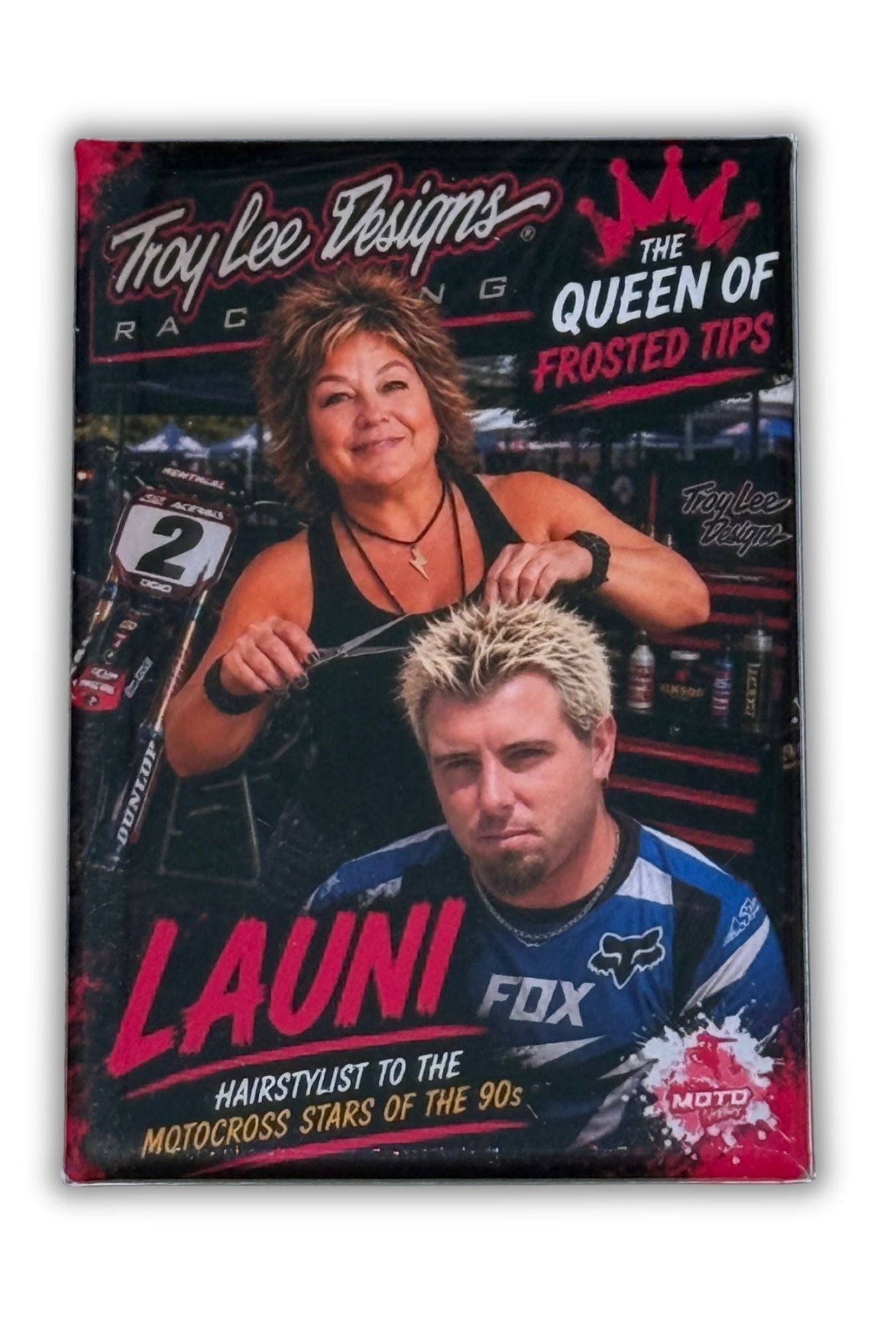 Launi, known as the Queen of Frosted Tips, styles a motocross rider's hair in this fun Moto Nineties collectible magnet celebrating 1990s motocross culture.